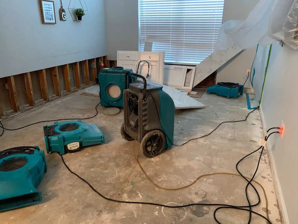 Dehumidifier in flood-cut room for Water Damage Restoration in Chesapeake Beach